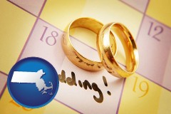 massachusetts map icon and wedding day plans, with gold wedding rings