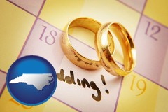 north-carolina map icon and wedding day plans, with gold wedding rings