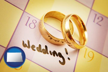 wedding day plans, with gold wedding rings - with North Dakota icon