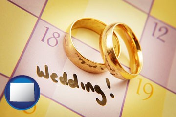 wedding day plans, with gold wedding rings - with Wyoming icon